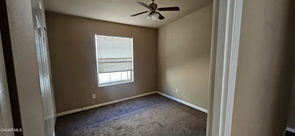 a view of empty room with windows