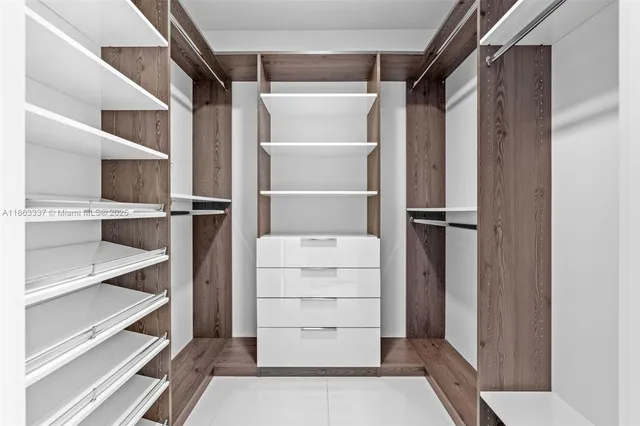 a white toilet sitting next to a white walls