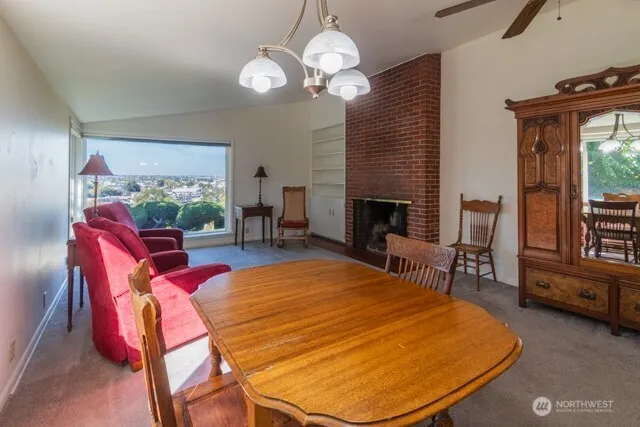 a view of a livingroom with furniture window and wooden floor