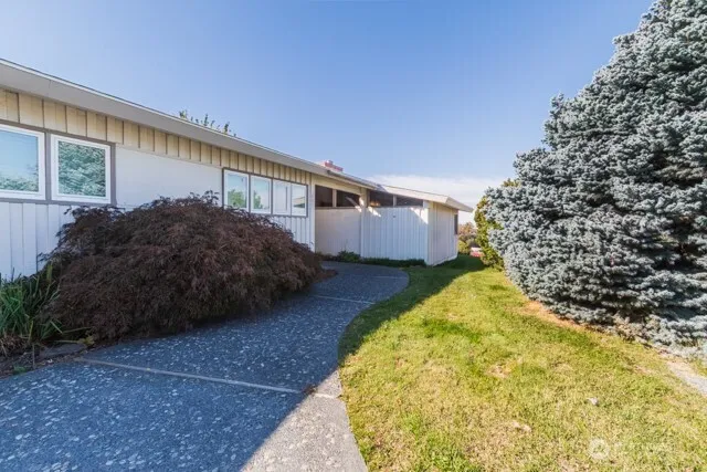 a view of a house with a yard and garage