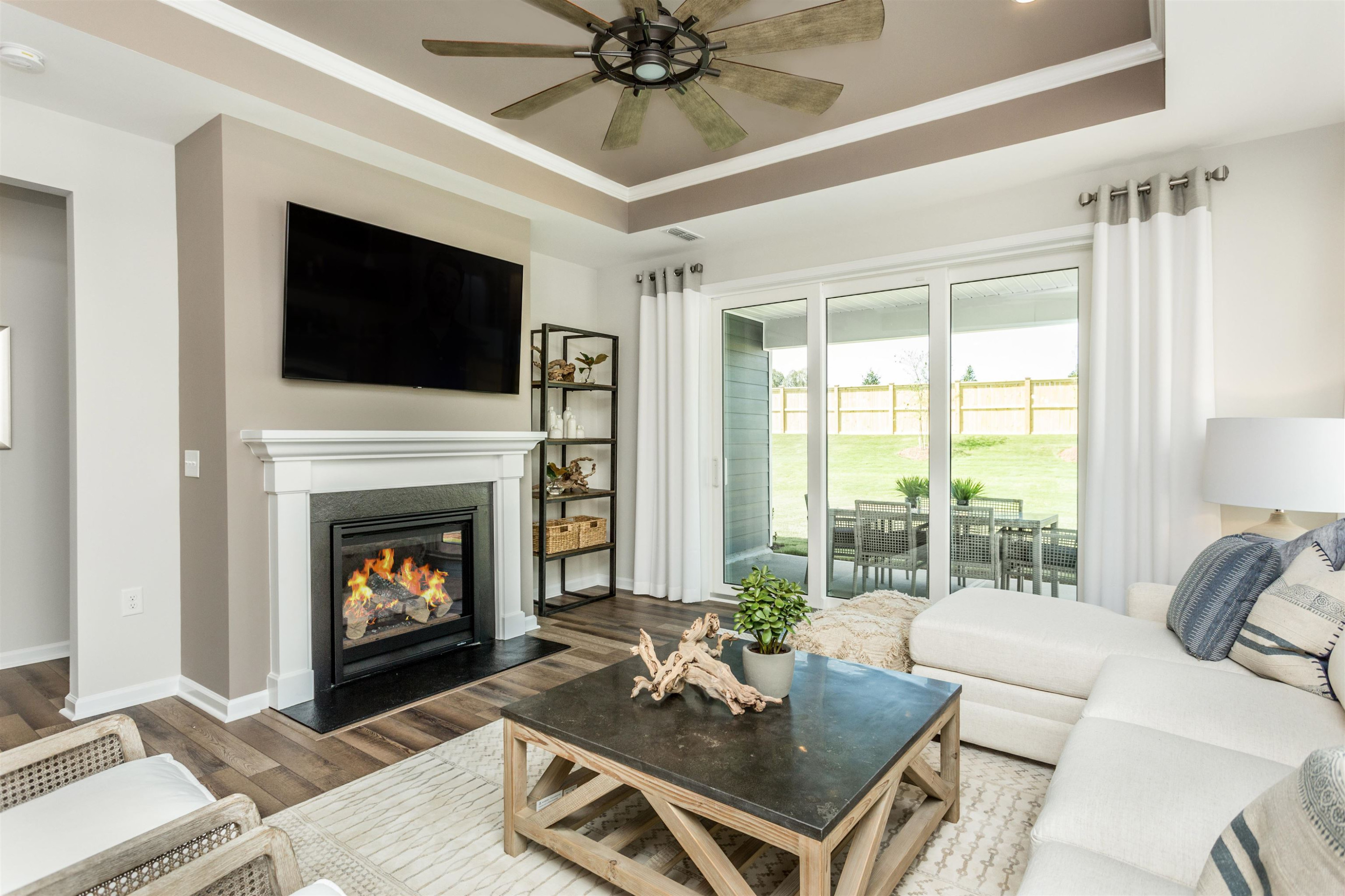 1405 Hornbeam Road Fuquay-Varina, NC 27526 - Photo 14 of 25 a living room with furniture a flat screen tv and a fireplace