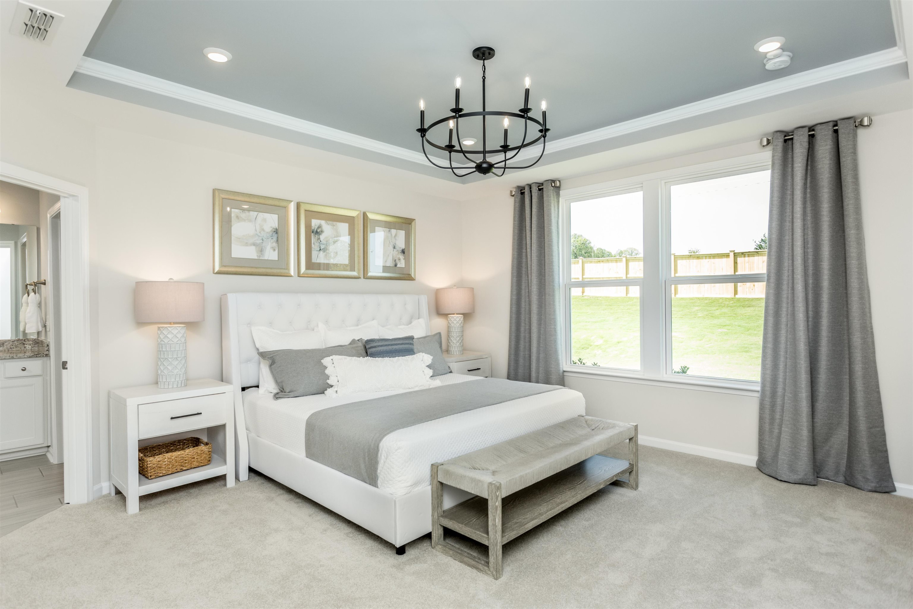 1405 Hornbeam Road Fuquay-Varina, NC 27526 - Photo 17 of 25 a bedroom with a bed chandelier and a window