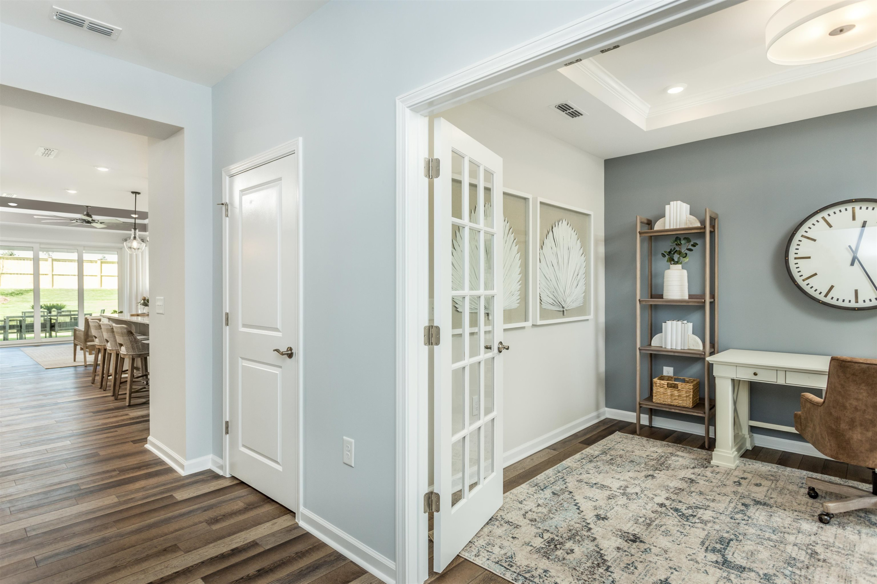 1405 Hornbeam Road Fuquay-Varina, NC 27526 - Photo 6 of 25 a view of a hallway with wooden floor and a bathroom