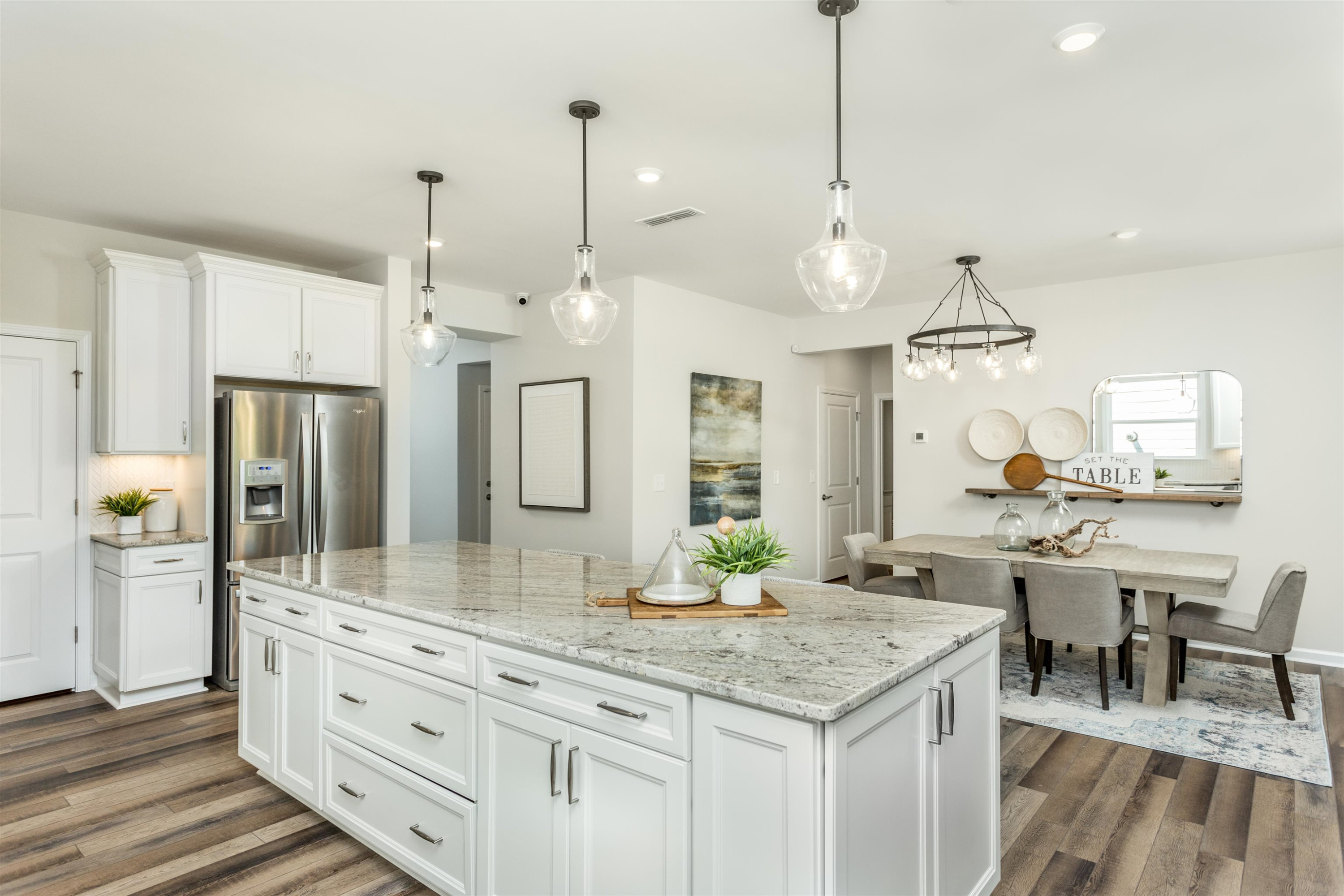 1405 Hornbeam Road Fuquay-Varina, NC 27526 - Photo 10 of 25 a large kitchen with kitchen island a large island in it
