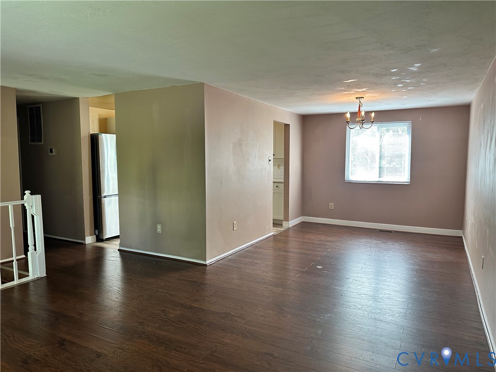 9319 Coleson Road Glen Allen, VA 23060 - Photo 13 of 39 an empty room with wooden floor and a window