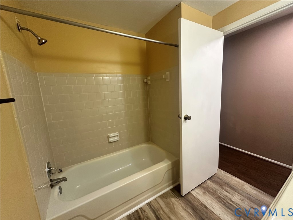 9319 Coleson Road Glen Allen, VA 23060 - Photo 20 of 39 a bathroom with a tub and shower