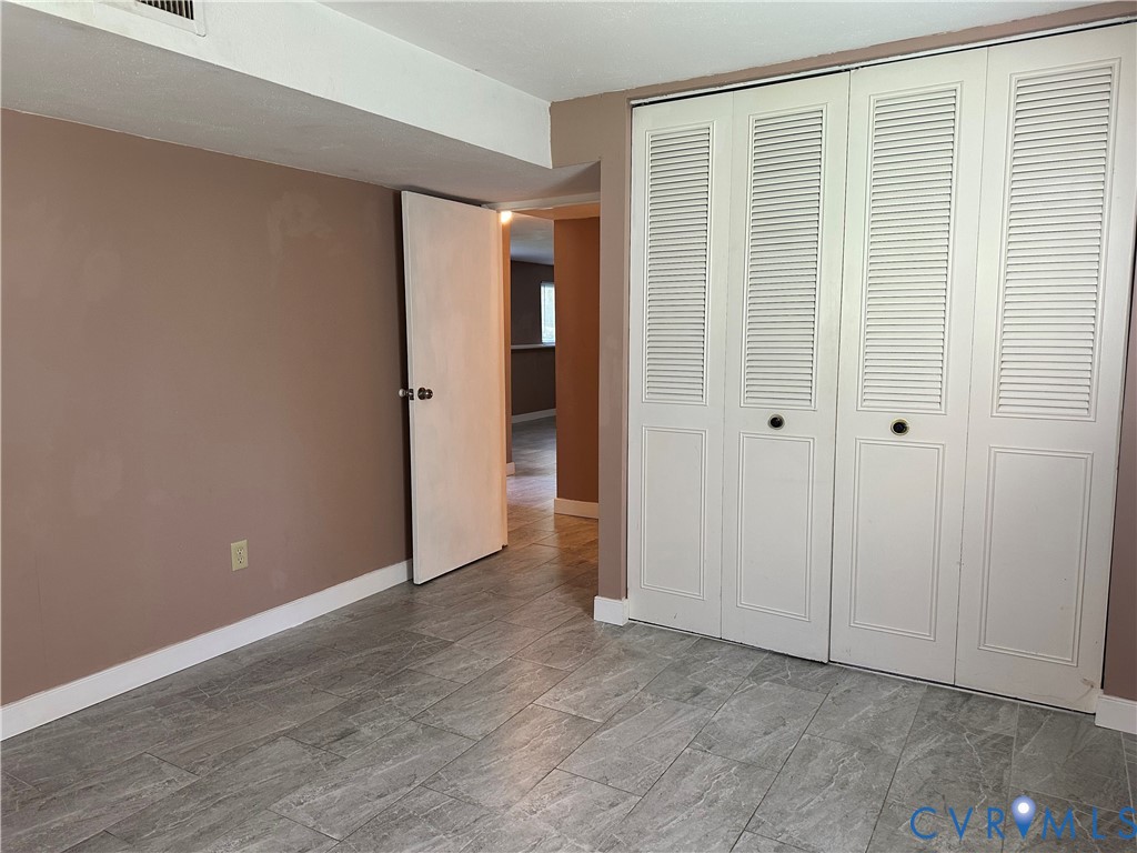 9319 Coleson Road Glen Allen, VA 23060 - Photo 28 of 39 a view of an empty room with wooden floor