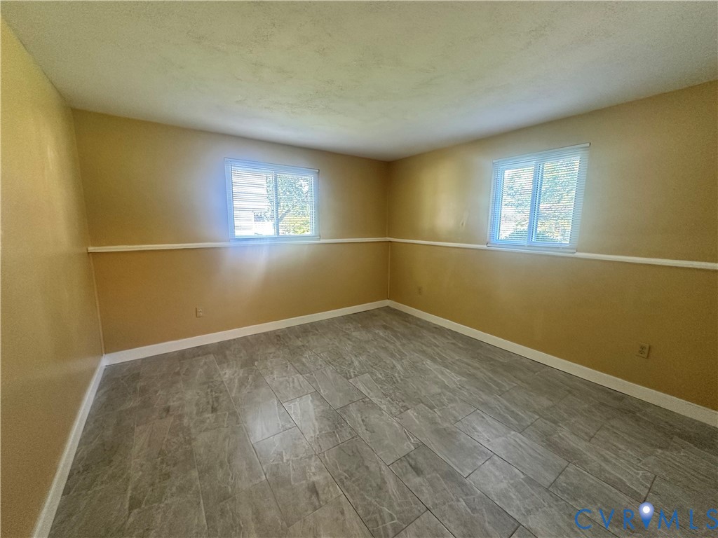 9319 Coleson Road Glen Allen, VA 23060 - Photo 29 of 39 wooden floor in an empty room with a window