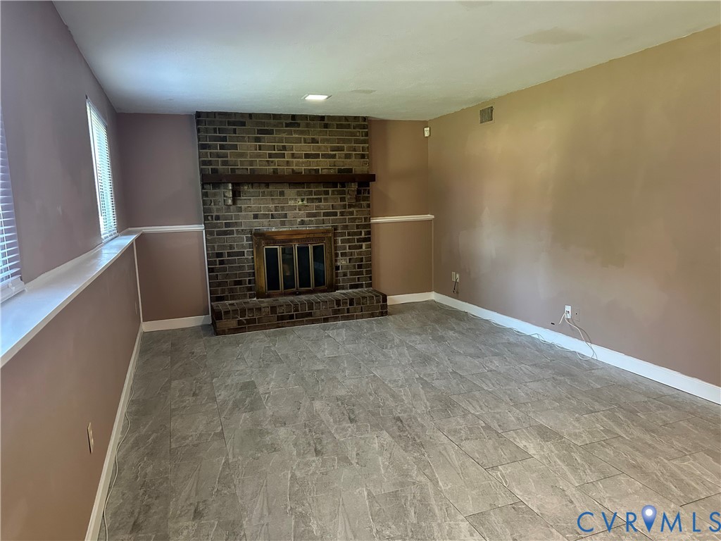 9319 Coleson Road Glen Allen, VA 23060 - Photo 35 of 39 a view of empty room with a fireplace