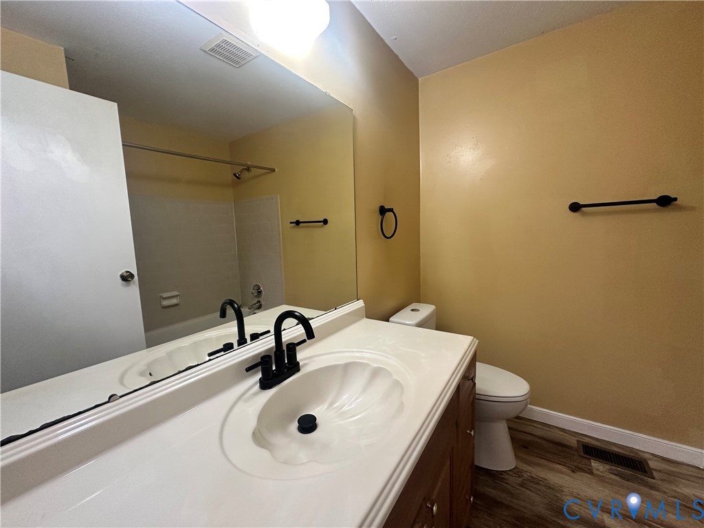 9319 Coleson Road Glen Allen, VA 23060 - Photo 37 of 39 a bathroom with a sink and a toilet