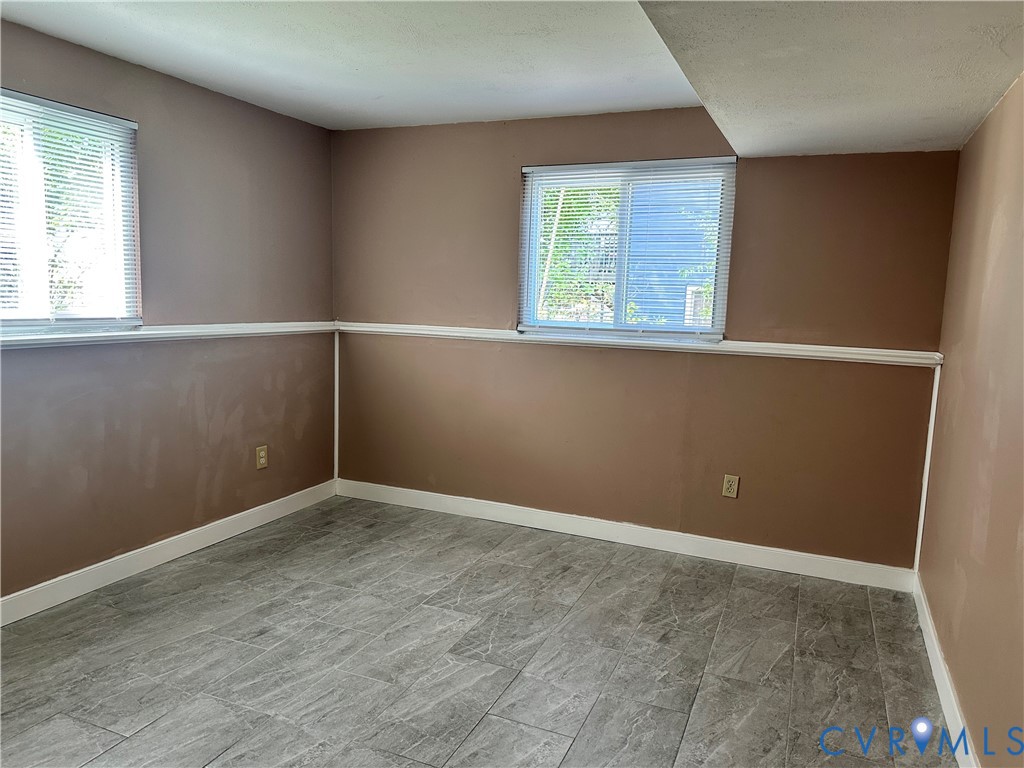 9319 Coleson Road Glen Allen, VA 23060 - Photo 38 of 39 an empty room with windows