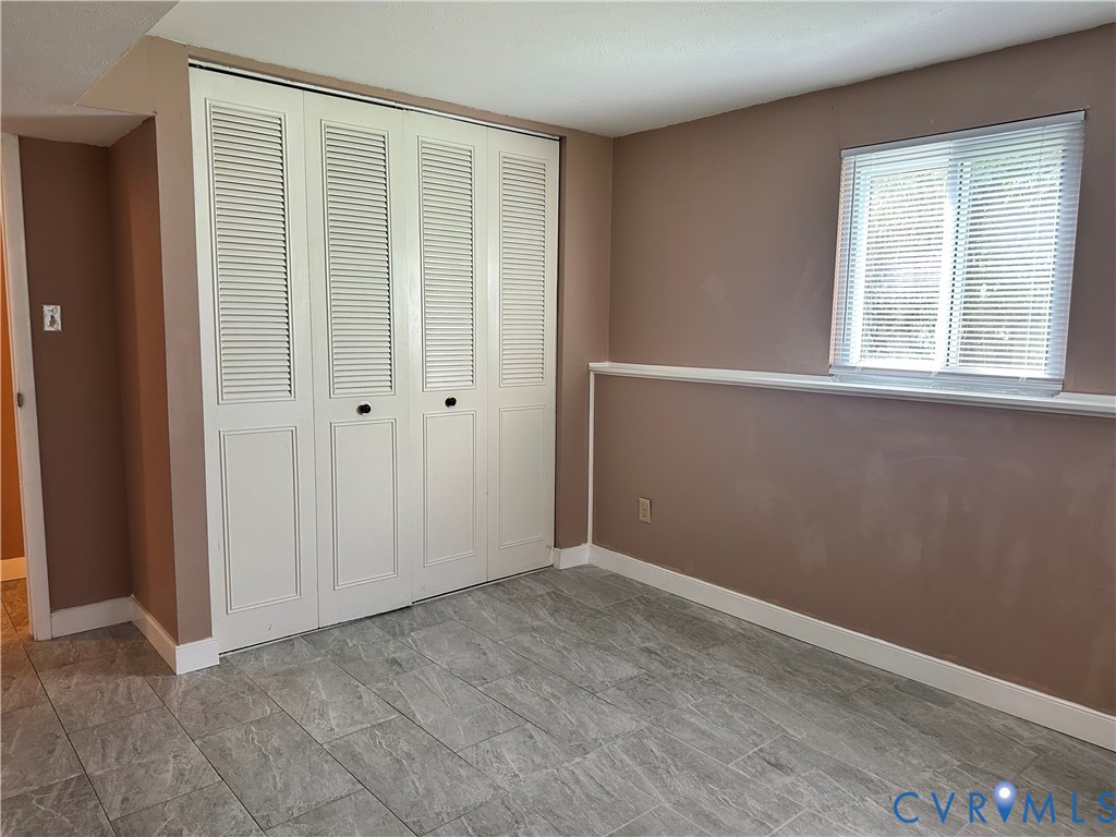 9319 Coleson Road Glen Allen, VA 23060 - Photo 39 of 39 an empty room with windows