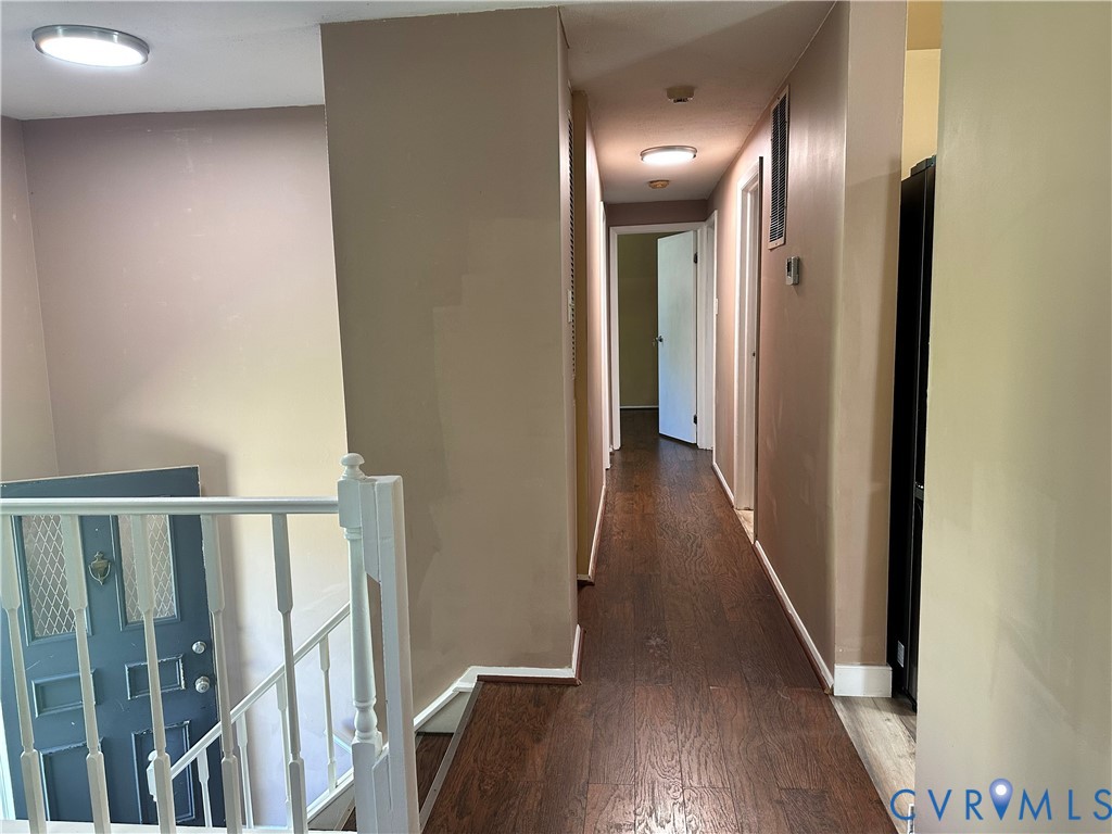 9319 Coleson Road Glen Allen, VA 23060 - Photo 8 of 39 a view of a hallway with wooden floor