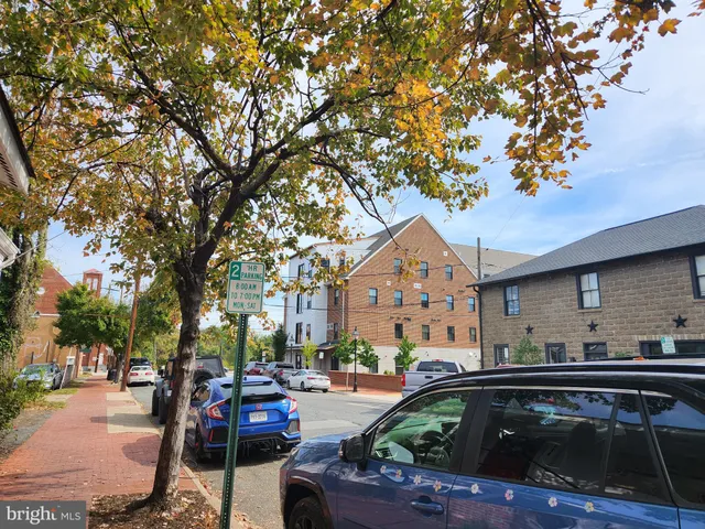 a front view of a house with swimming pool and sitting area