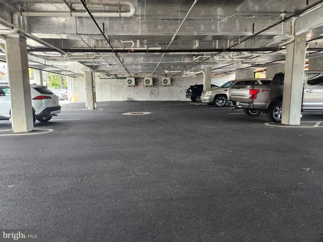 a view of parking garage with cars
