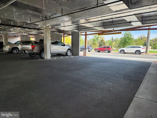 a view of parking garage with cars
