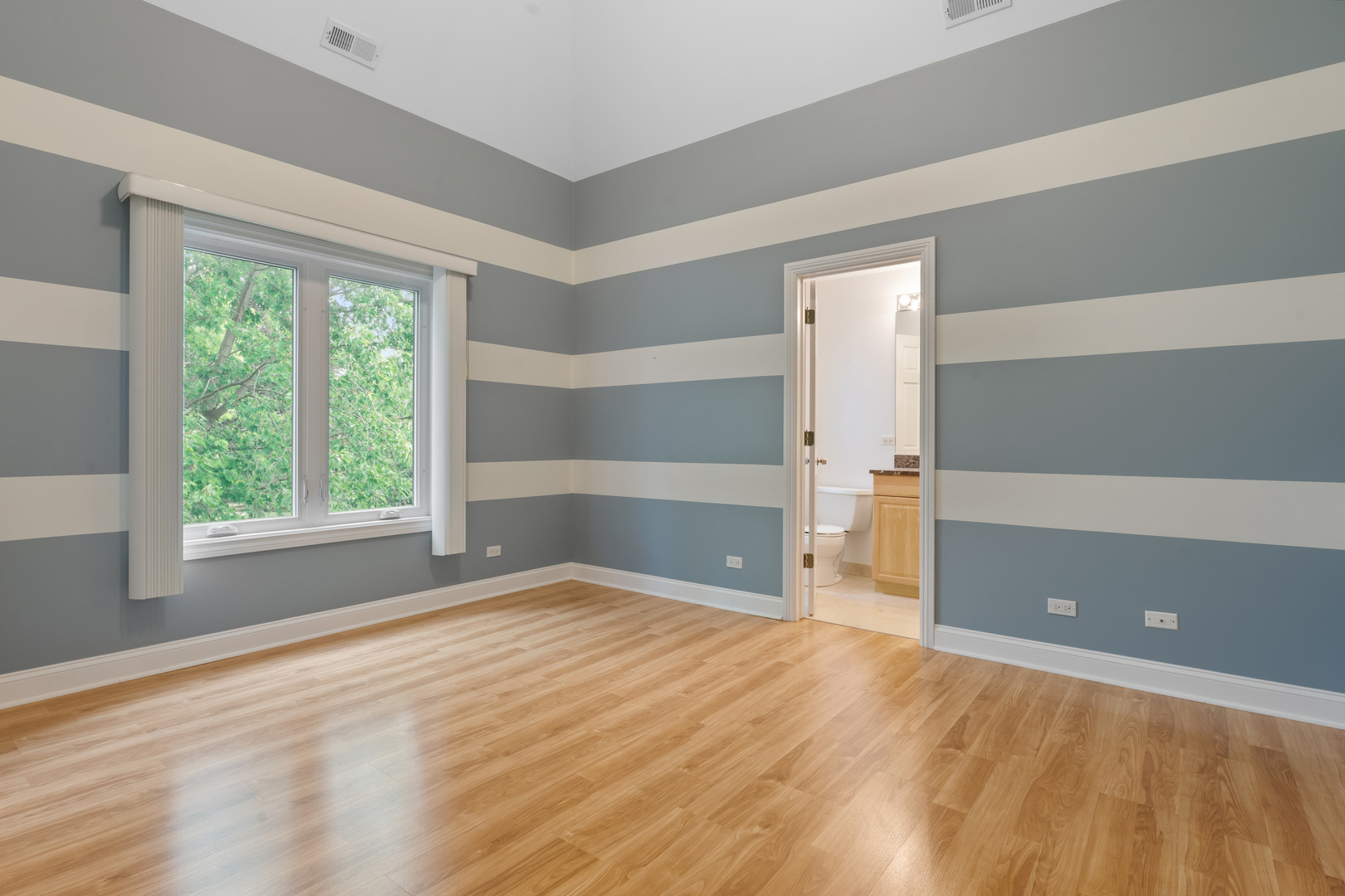 1184 Prospect Lane Des Plaines, IL 60018 - Photo 15 of 24 a view of empty room with wooden floor and fan