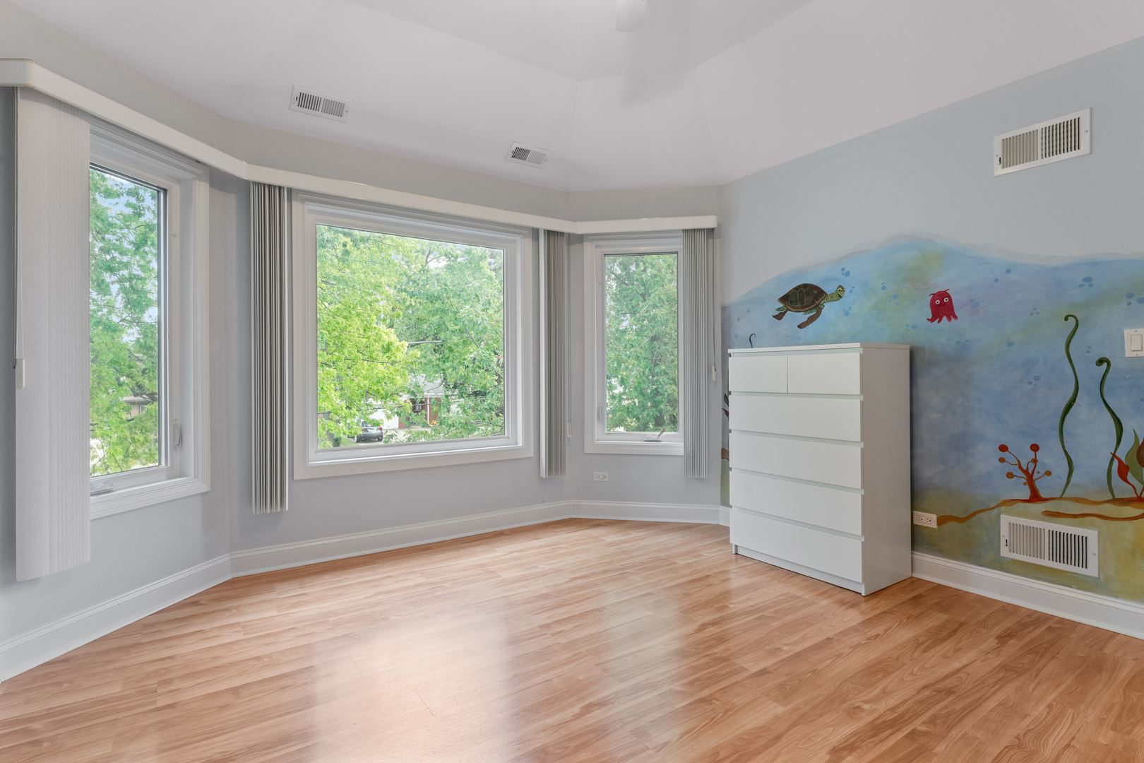 1184 Prospect Lane Des Plaines, IL 60018 - Photo 17 of 24 an empty room with wooden floor and windows