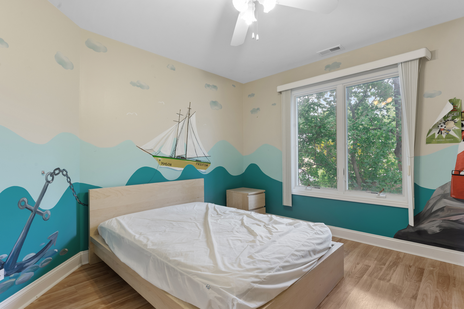 1184 Prospect Lane Des Plaines, IL 60018 - Photo 19 of 24 a bed sitting in a bedroom next to a window