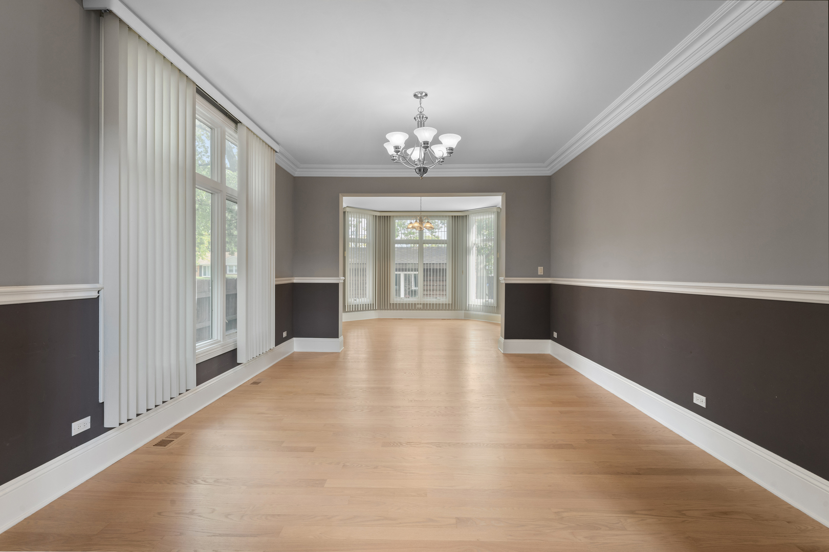 1184 Prospect Lane Des Plaines, IL 60018 - Photo 7 of 24 wooden floor in an empty room with a window