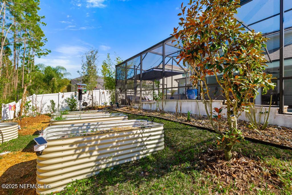 201 Oak Shadow Place St. Johns, FL 32259 - Photo 37 of 52 a view of a fountain in the backyard of the house