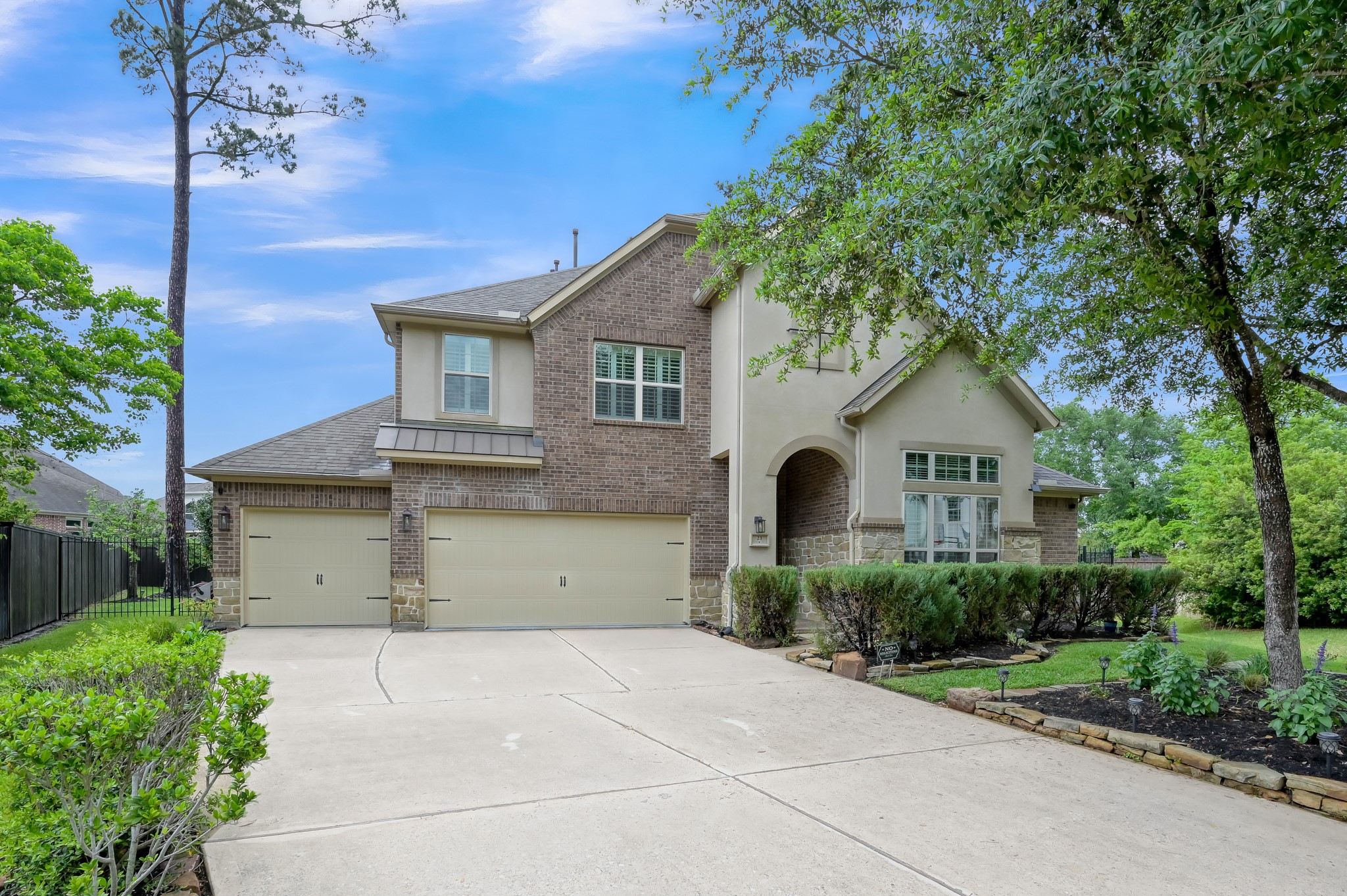 23 Rancher's Trail Tomball, TX 77375 - Photo 38 of 40 This meticulously maintained home boasts stunning landscaping, a welcoming walkup, and a spacious three-car garage with floors that have been finished with a sleek epoxy finish.