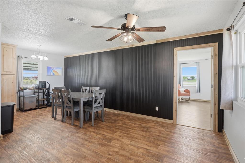 1051 Pigg Road Waxahachie, TX 75165 - Photo 13 of 40 a view of a livingroom with furniture and wooden floor