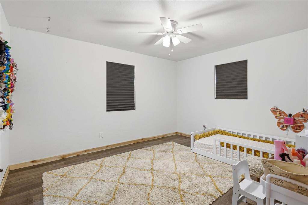 1051 Pigg Road Waxahachie, TX 75165 - Photo 17 of 40 a view of a bedroom with a bed