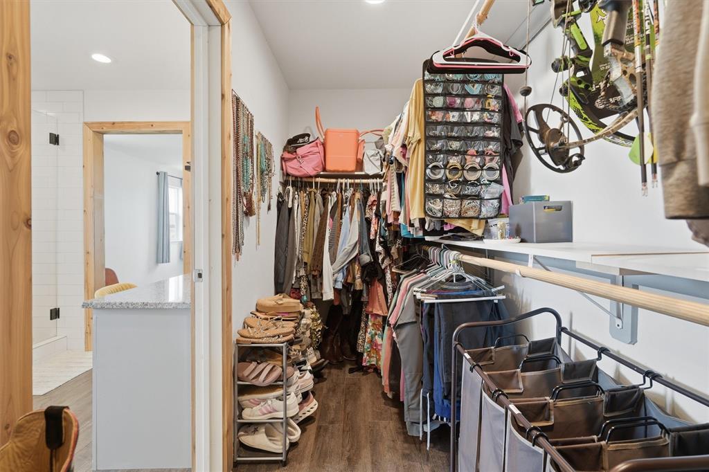 1051 Pigg Road Waxahachie, TX 75165 - Photo 21 of 40 a view of a storage and utility room with racks on the wall