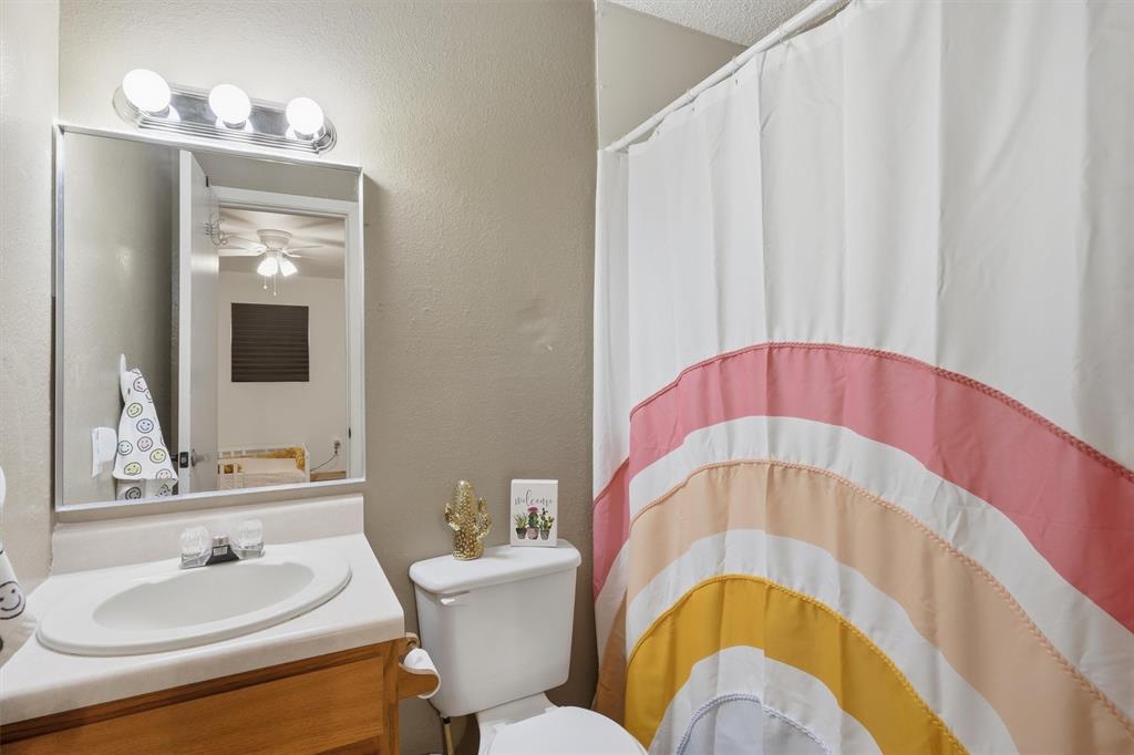 1051 Pigg Road Waxahachie, TX 75165 - Photo 25 of 40 a bathroom with a sink and a mirror