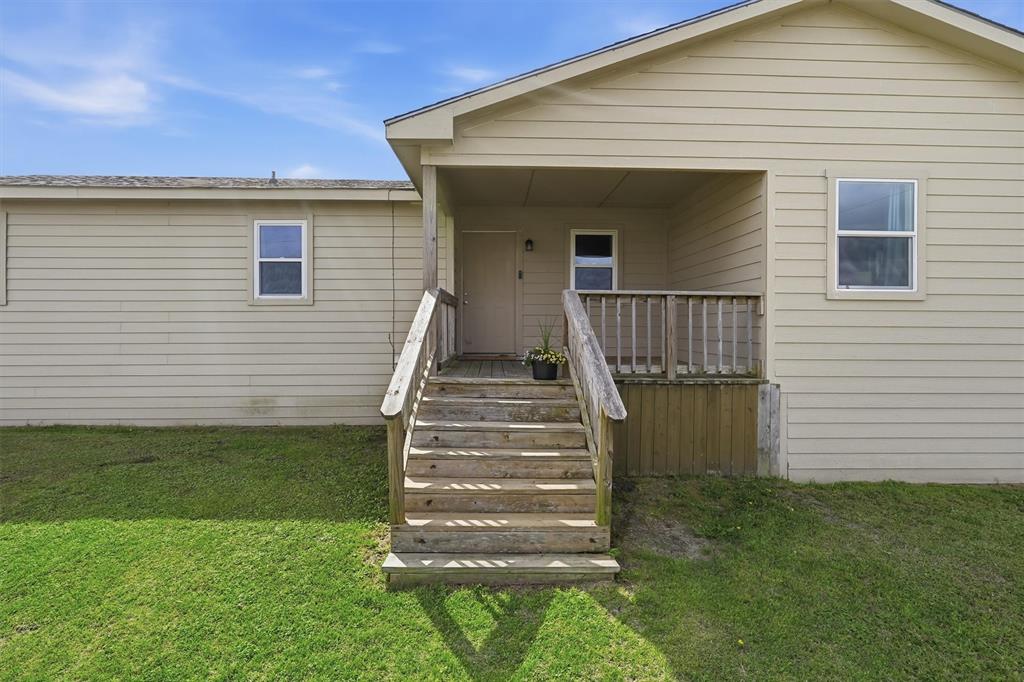 1051 Pigg Road Waxahachie, TX 75165 - Photo 3 of 40 a view of a house with a yard