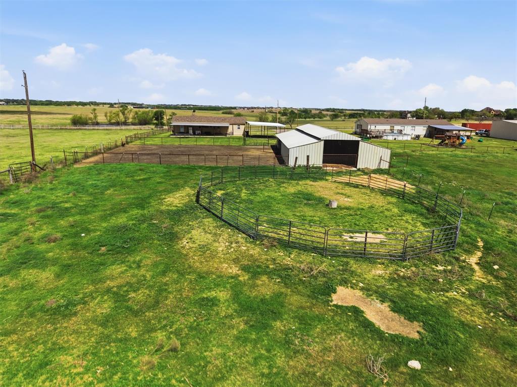 1051 Pigg Road Waxahachie, TX 75165 - Photo 39 of 40 a view of a swimming pool with a yard