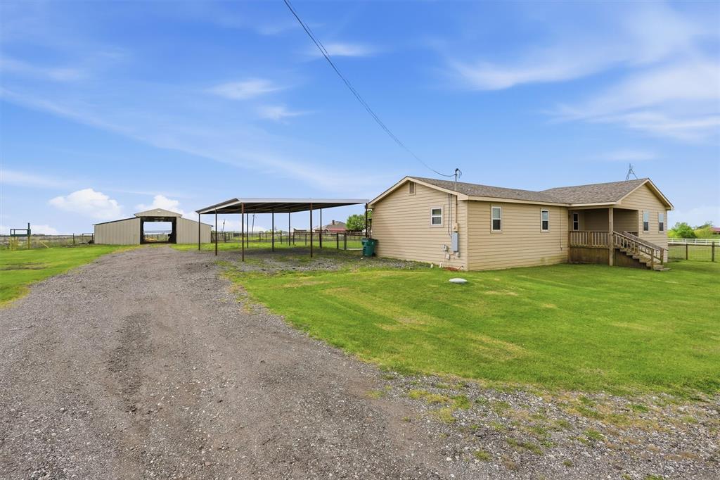 1051 Pigg Road Waxahachie, TX 75165 - Photo 4 of 40 a view of a house with backyard