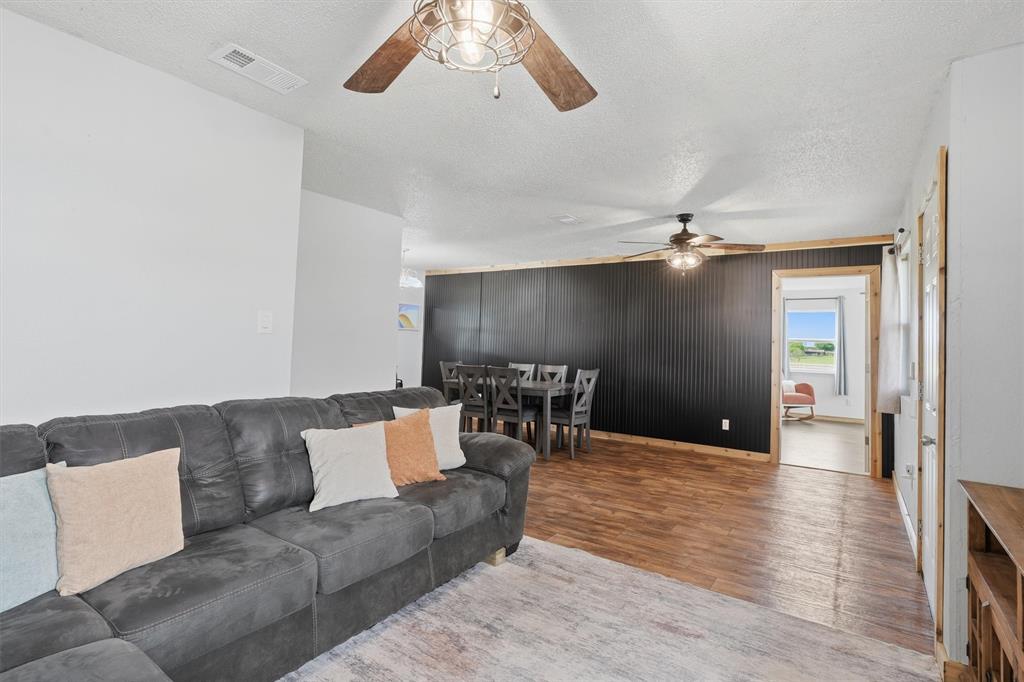 1051 Pigg Road Waxahachie, TX 75165 - Photo 8 of 40 a living room with furniture and a wooden floor