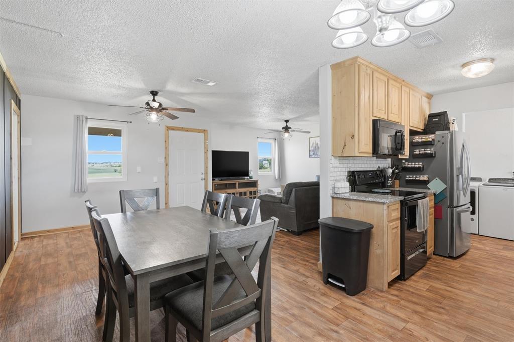 1051 Pigg Road Waxahachie, TX 75165 - Photo 10 of 40 a view of kitchen with cabinets and wooden floor