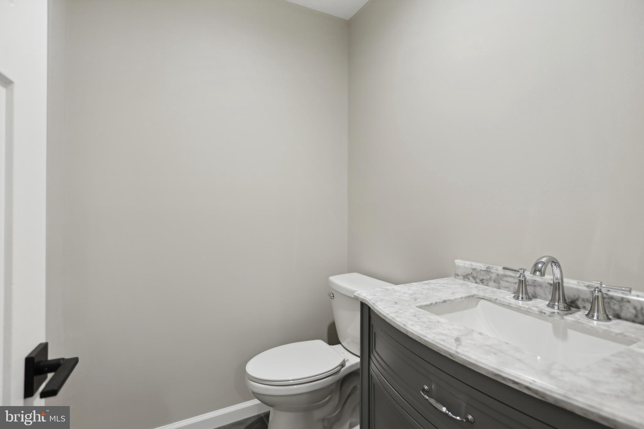 6719 Clinglog Street Capitol Heights, MD 20743 - Photo 10 of 26 Main level half bath just off the kitchen