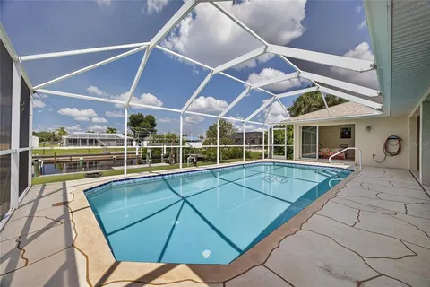 a view of a patio with a table and chairs