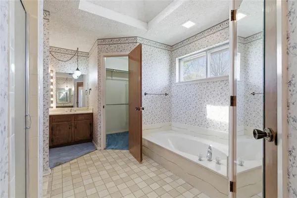 a bathroom with a sink double vanity and a mirror