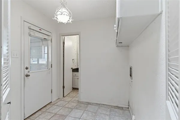 a bathroom with a granite countertop double vanity sink a mirror and a