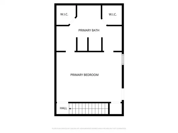 a view of a hallway with wooden floor and a livingroom