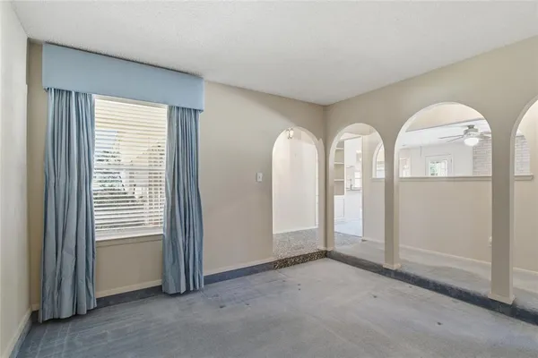 a view of a livingroom with furniture and windows