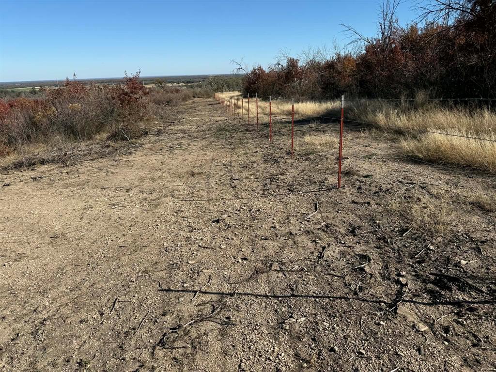 436 County Road 436 Rising Star, TX 76471 - Photo 10 of 18 a view of a dry yard with wooden fence