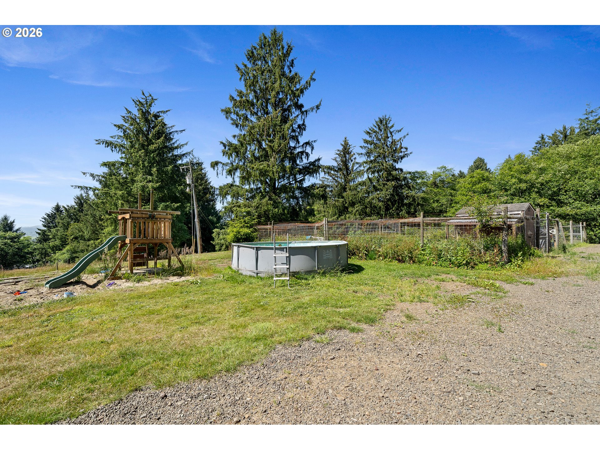850 Hodgdon Road Tillamook, OR 97141 - Photo 36 of 43 a backyard of a house with table and chairs