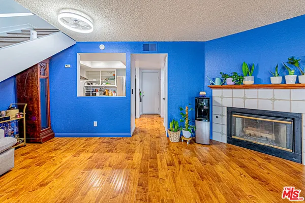 a bedroom with a bed and a fireplace