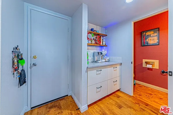 a room with cabinets and wooden floor
