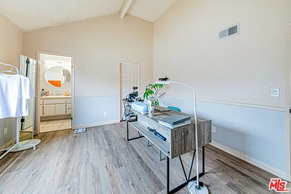 a workspace with furniture and wooden floor