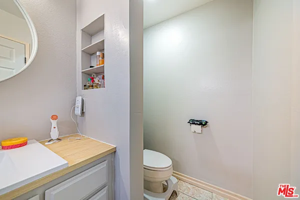 a bathroom with a toilet and a sink