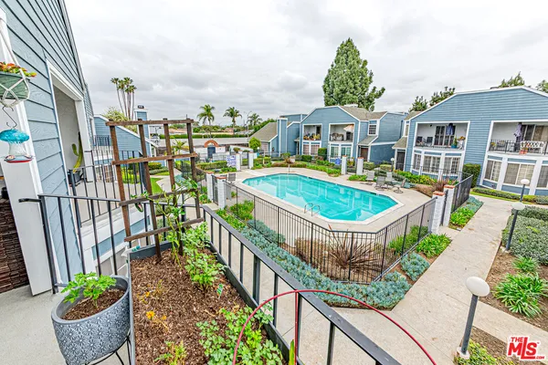a front view of a house with outdoor seating yard