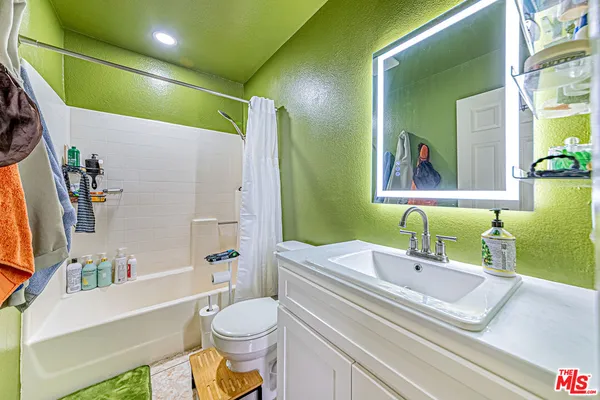 a bathroom with a sink a toilet and a bathtub