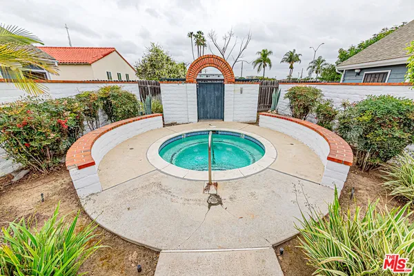 an aerial view of a house with a swimming pool
